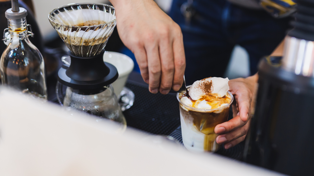 barista pouring espresso coffee