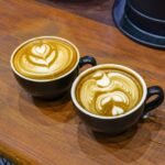 Cups of coffee Latte on wood table